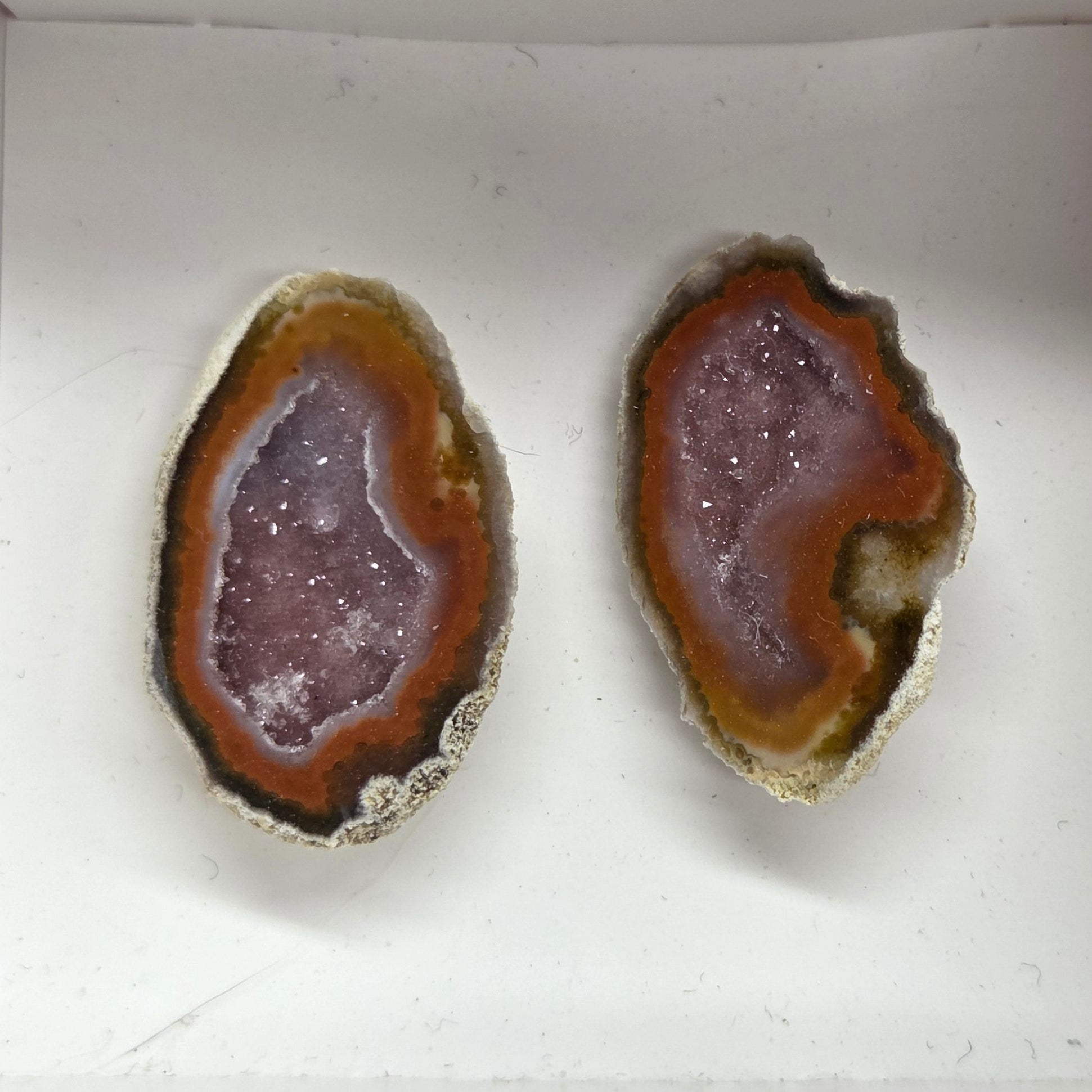 Set of geode crystals in a small white box