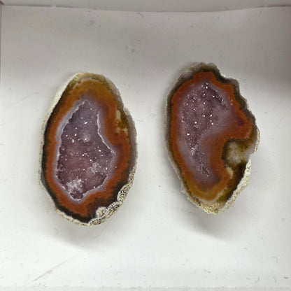 Set of geode crystals in a small white box