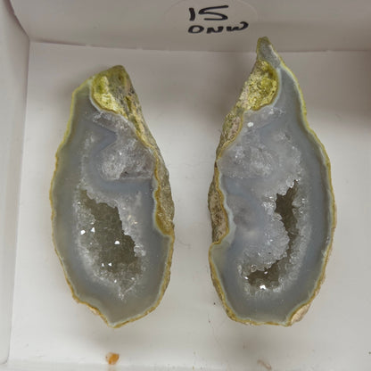 Set of geode crystals in a small white box