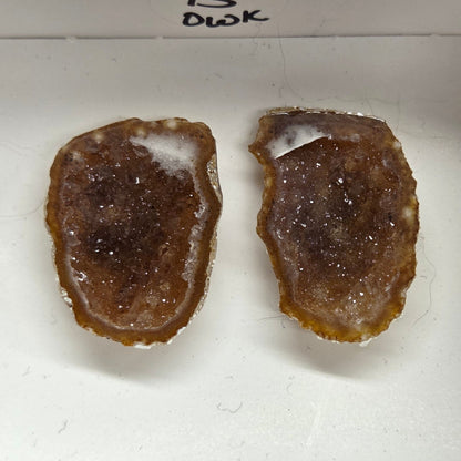 Set of geode crystals in a small white box
