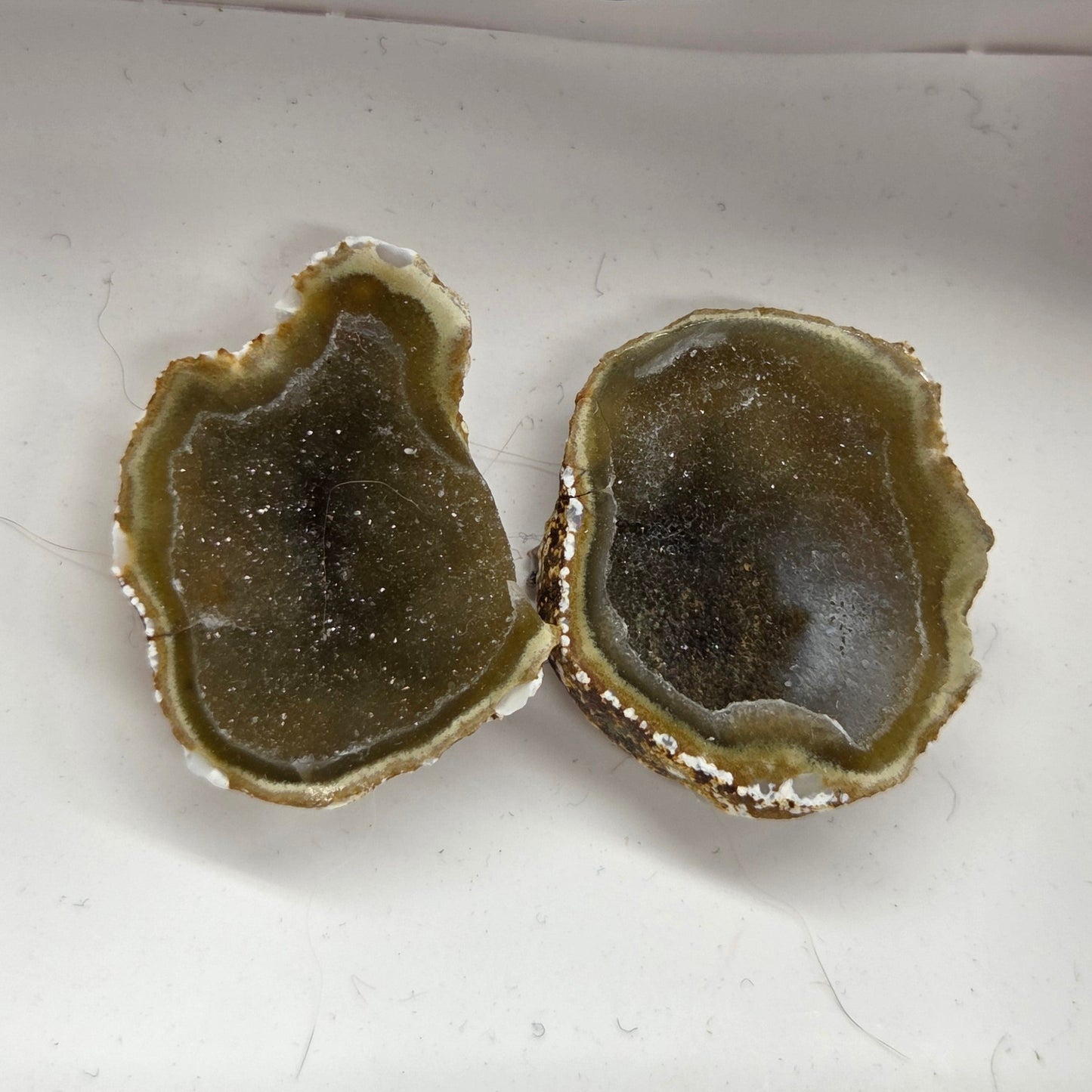 Set of geode crystals in a small white box