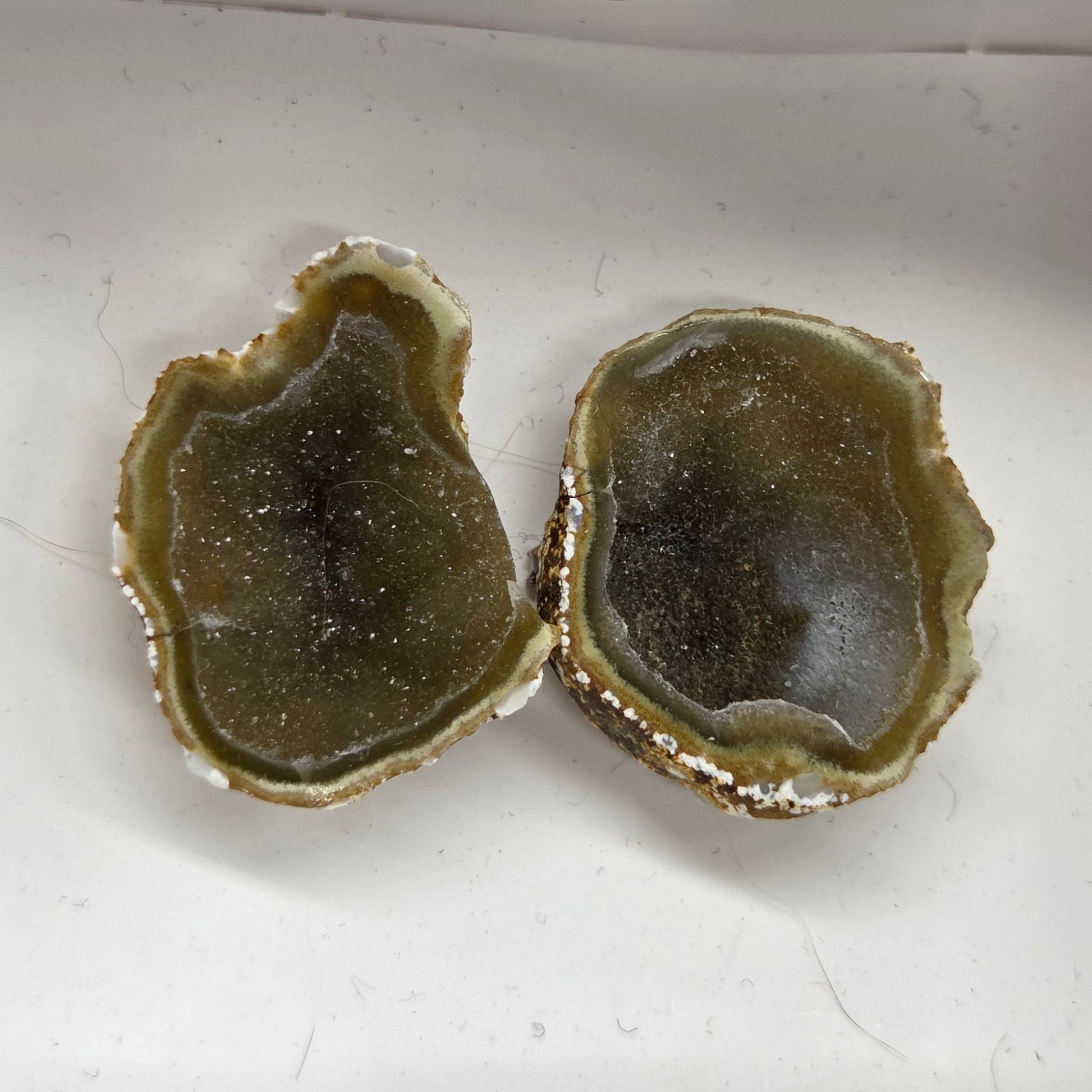 Set of geode crystals in a small white box