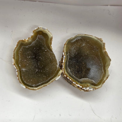 Set of geode crystals in a small white box