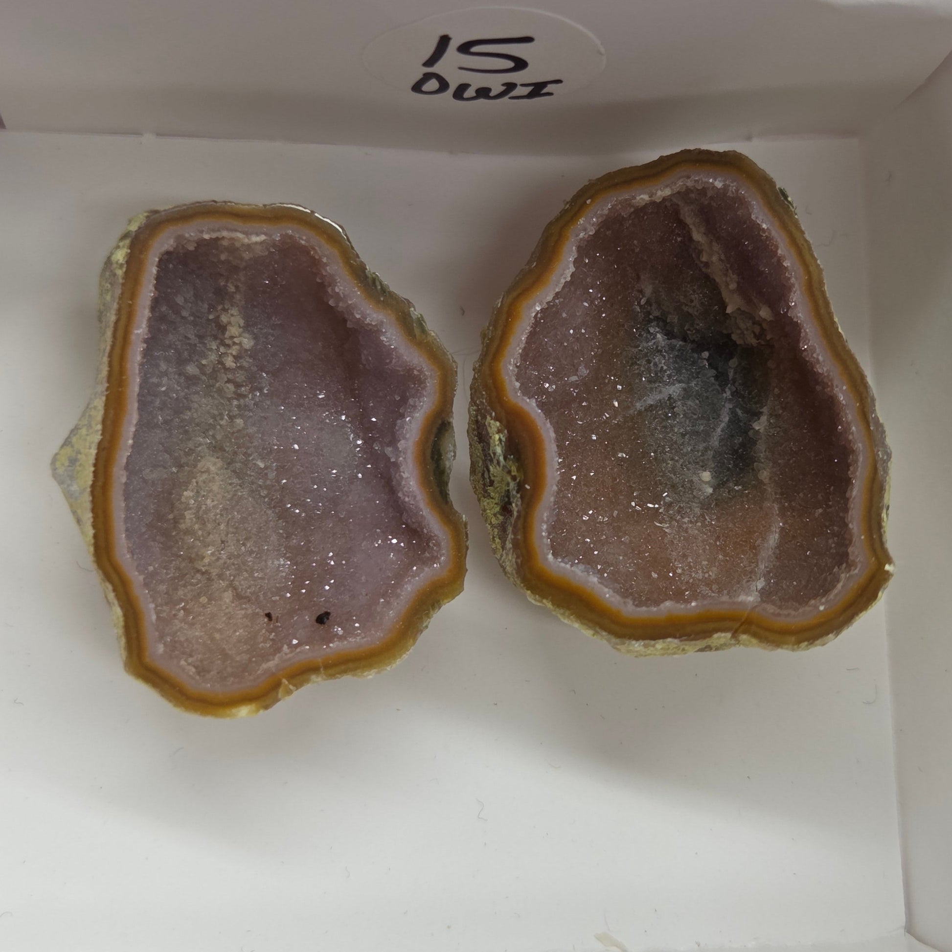 Set of geode crystals in a small white box