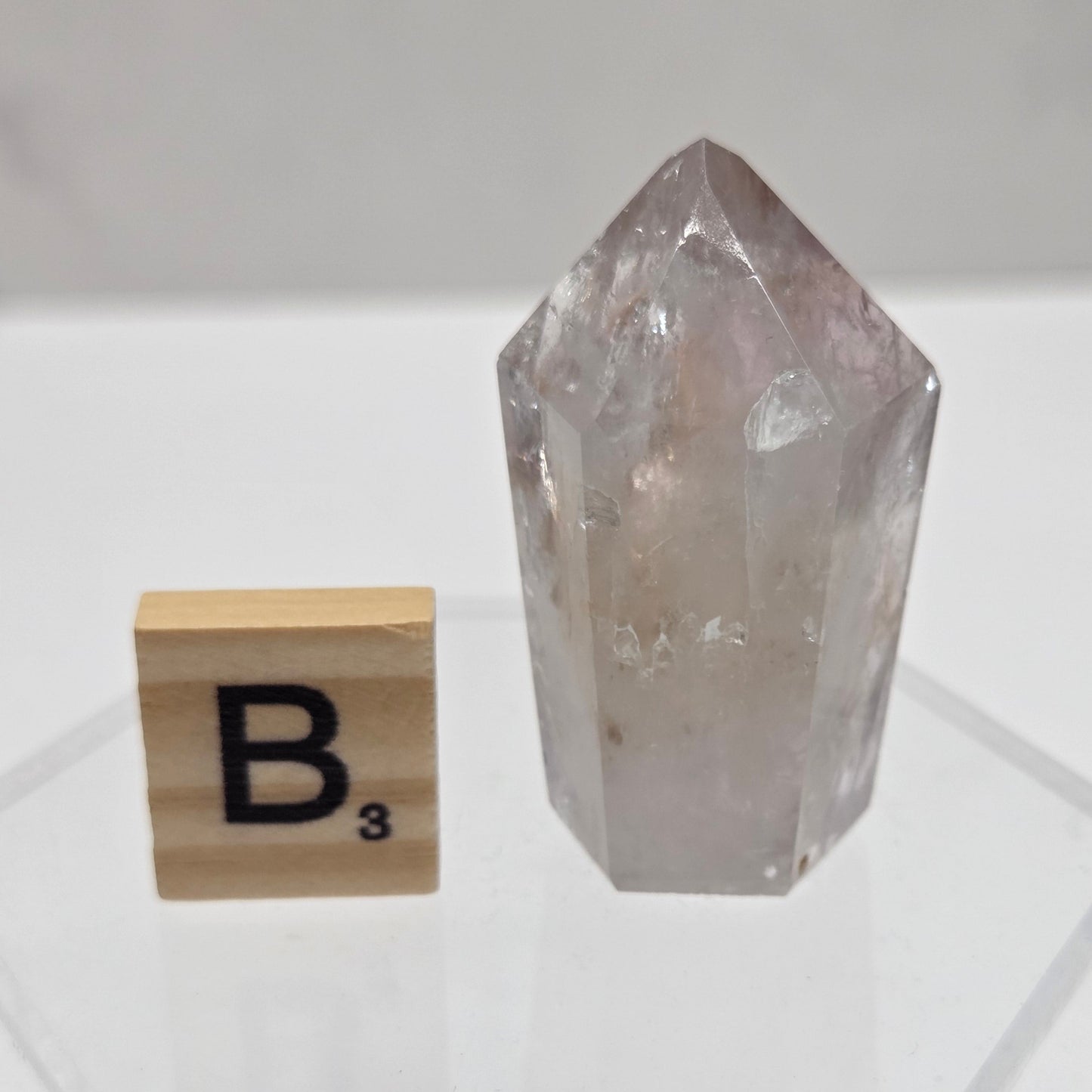 Crystal-like object with a block labeled 'B' on a white background