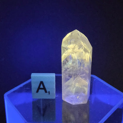 Crystal on a hexagonal stand with a dark background