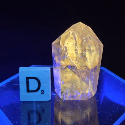 Clear crystal with a yellow tint on a black background