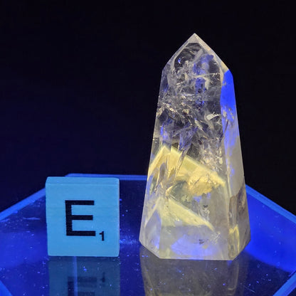 Clear crystal point  on a dark background