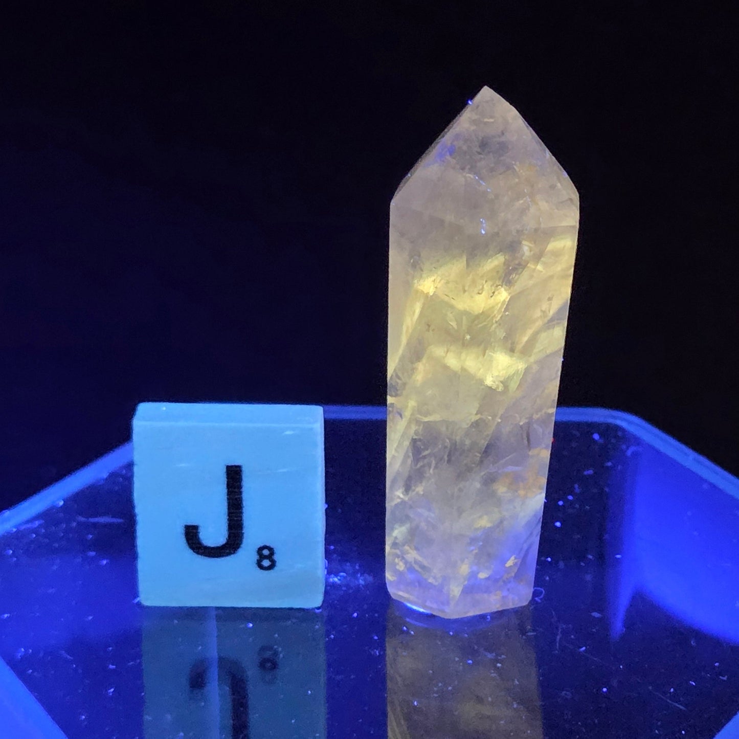Crystal under UV light with a blue protective case
