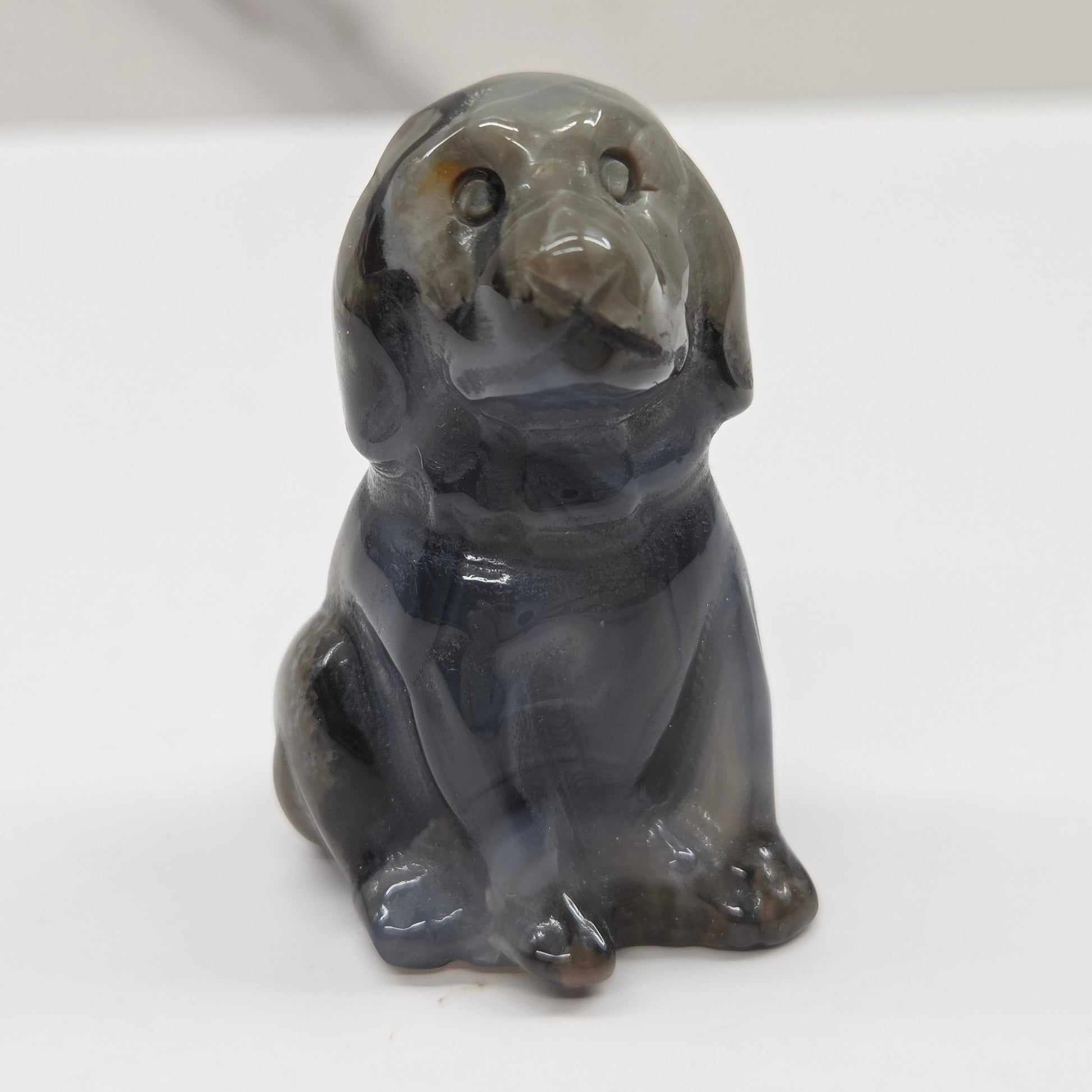 Stone dog figurine on a white background