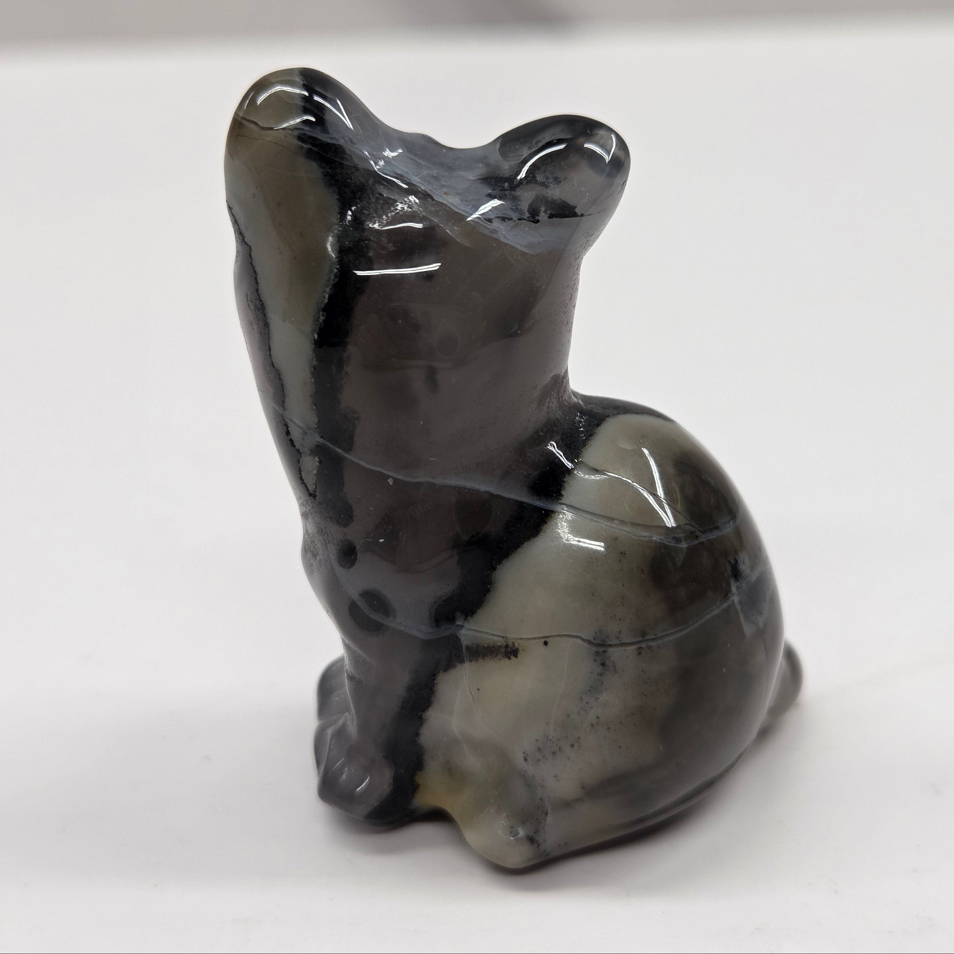 Stone cat carving white background