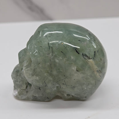 Green crystal skull on a white background