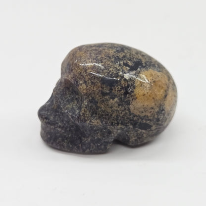 Small stone skull on a white background