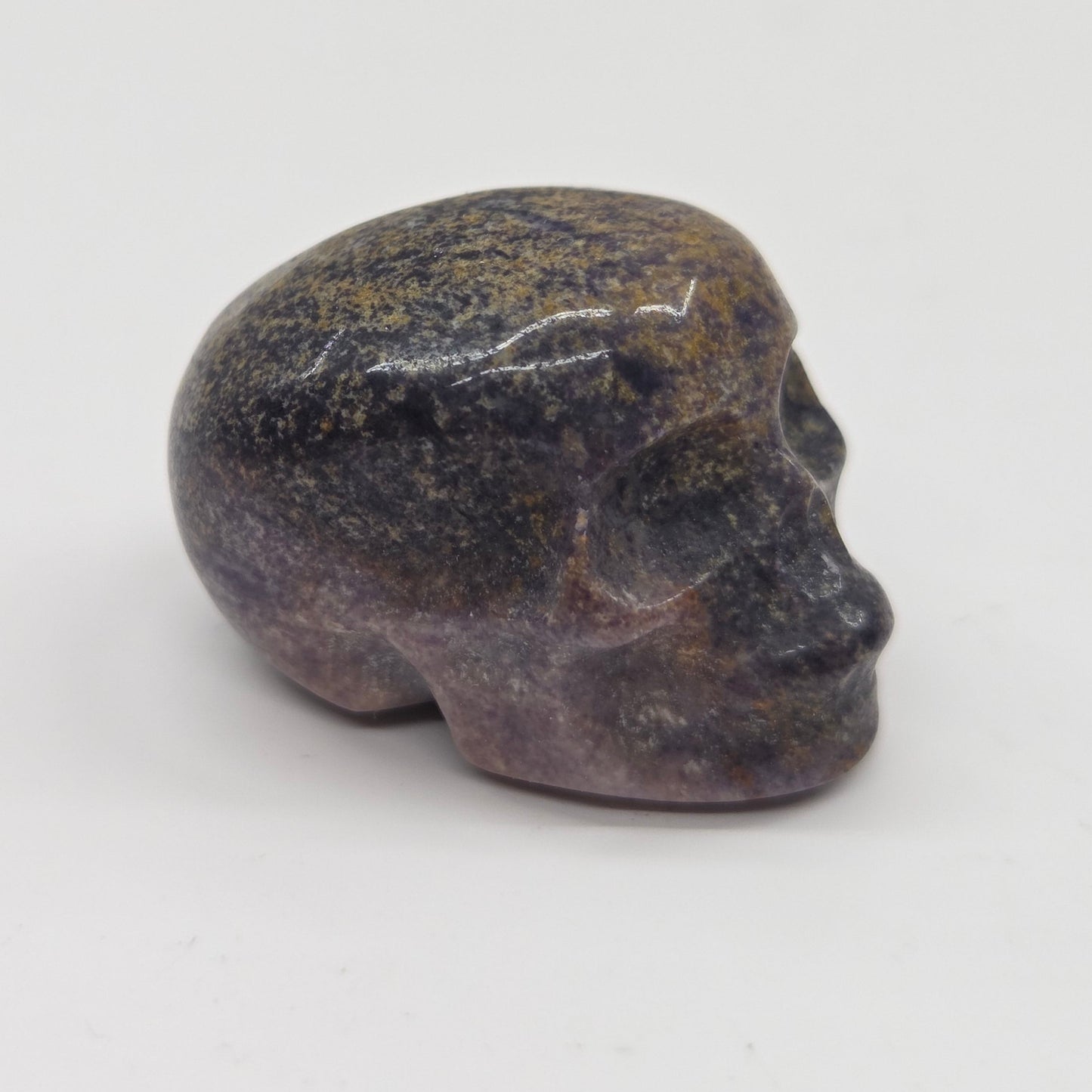Stone skull figurine on a white background