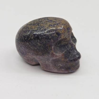 Stone skull figurine on a white background