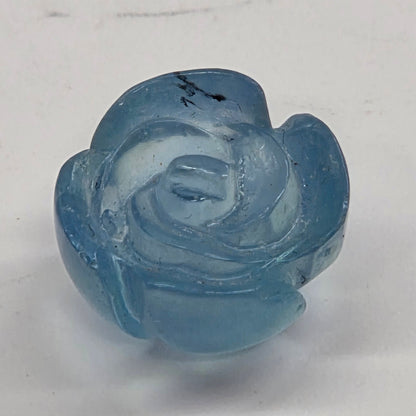 Blue rose-shaped object on a white background