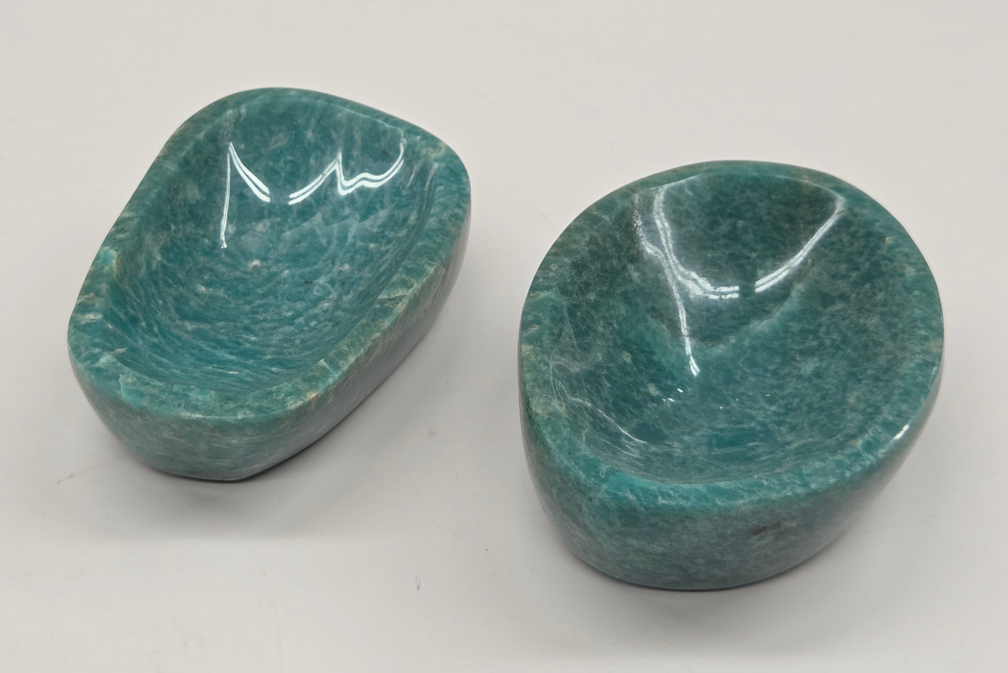 Two green amazonite carved bowls  on a white background