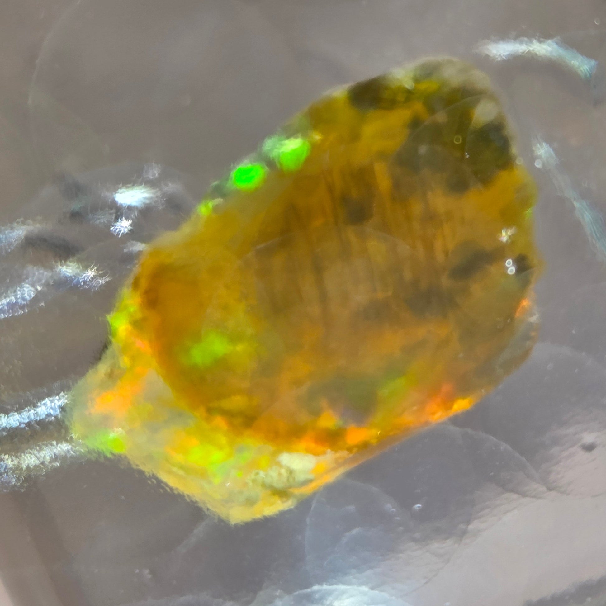 Opal stone on a reflective surface