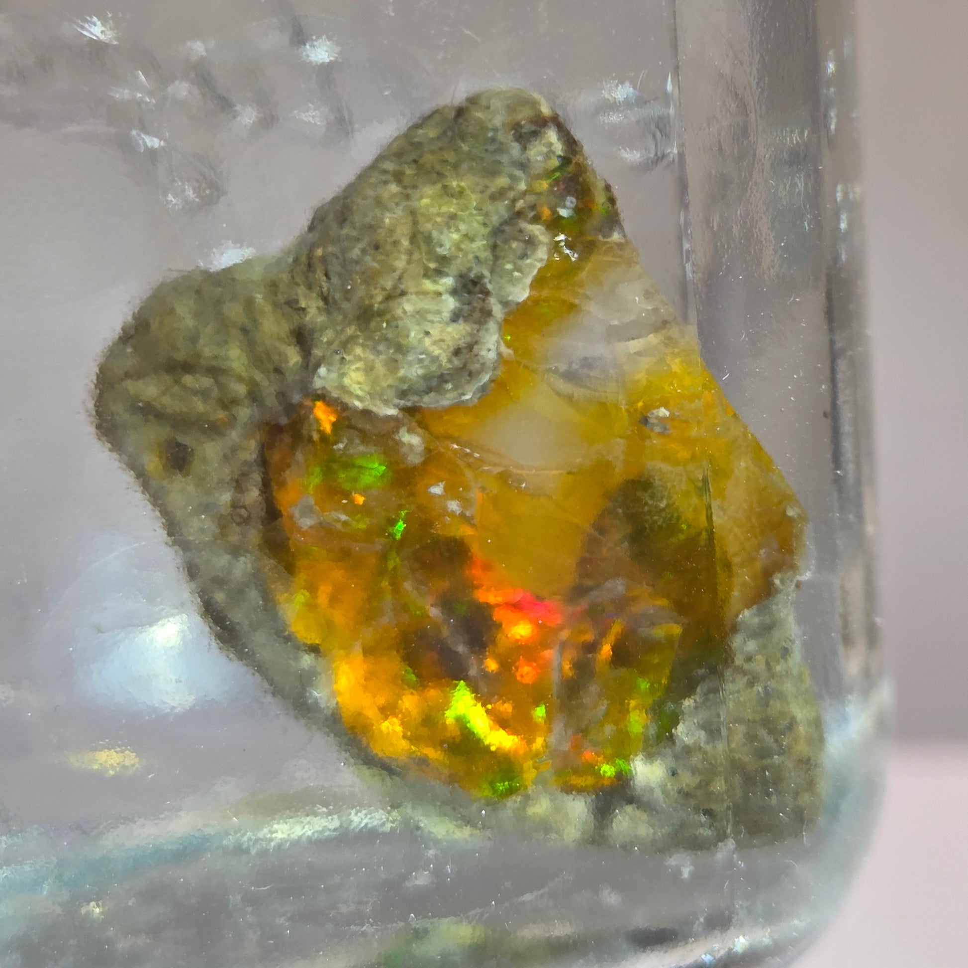 Mineral sample with a colorful interior on a clear background