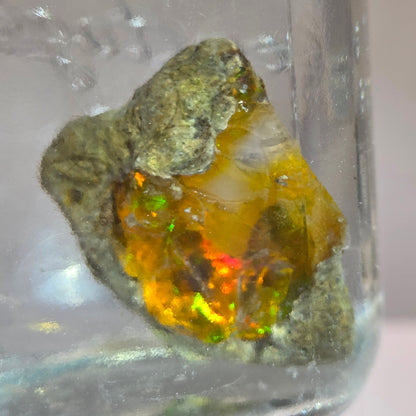 Mineral sample with a colorful interior on a clear background