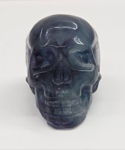 Fluorite skull carving on a white background
