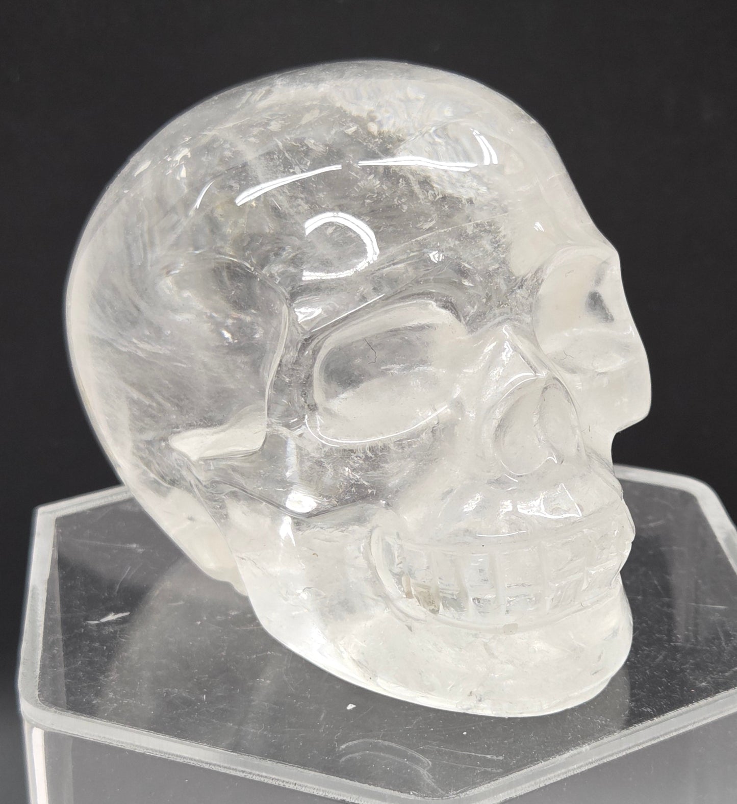 Clear Quartz skull on a black background
