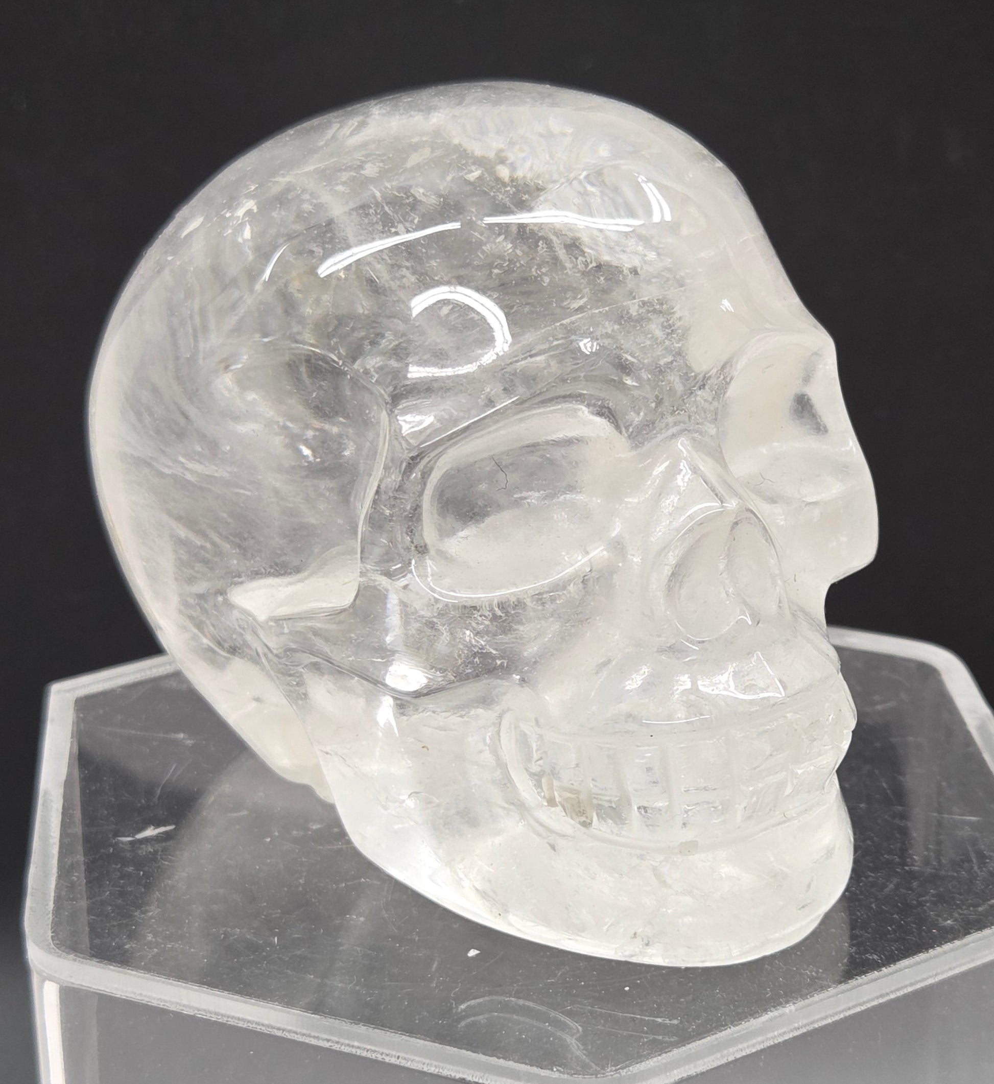 Clear Quartz skull on a black background