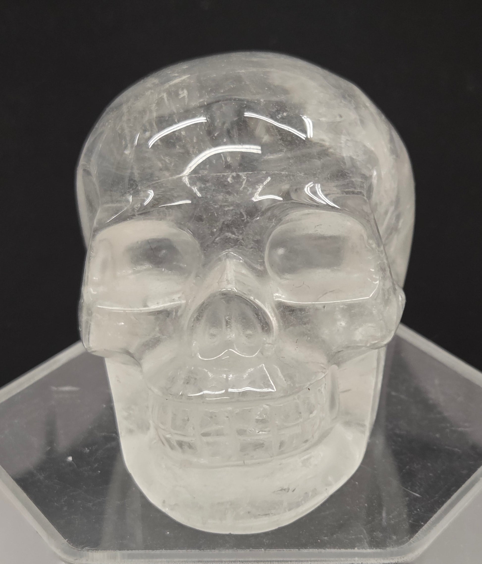 Clear Quartz skull on a black background