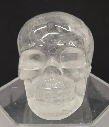 Clear Quartz skull on a black background