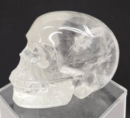 Clear Quartz skull on a black background