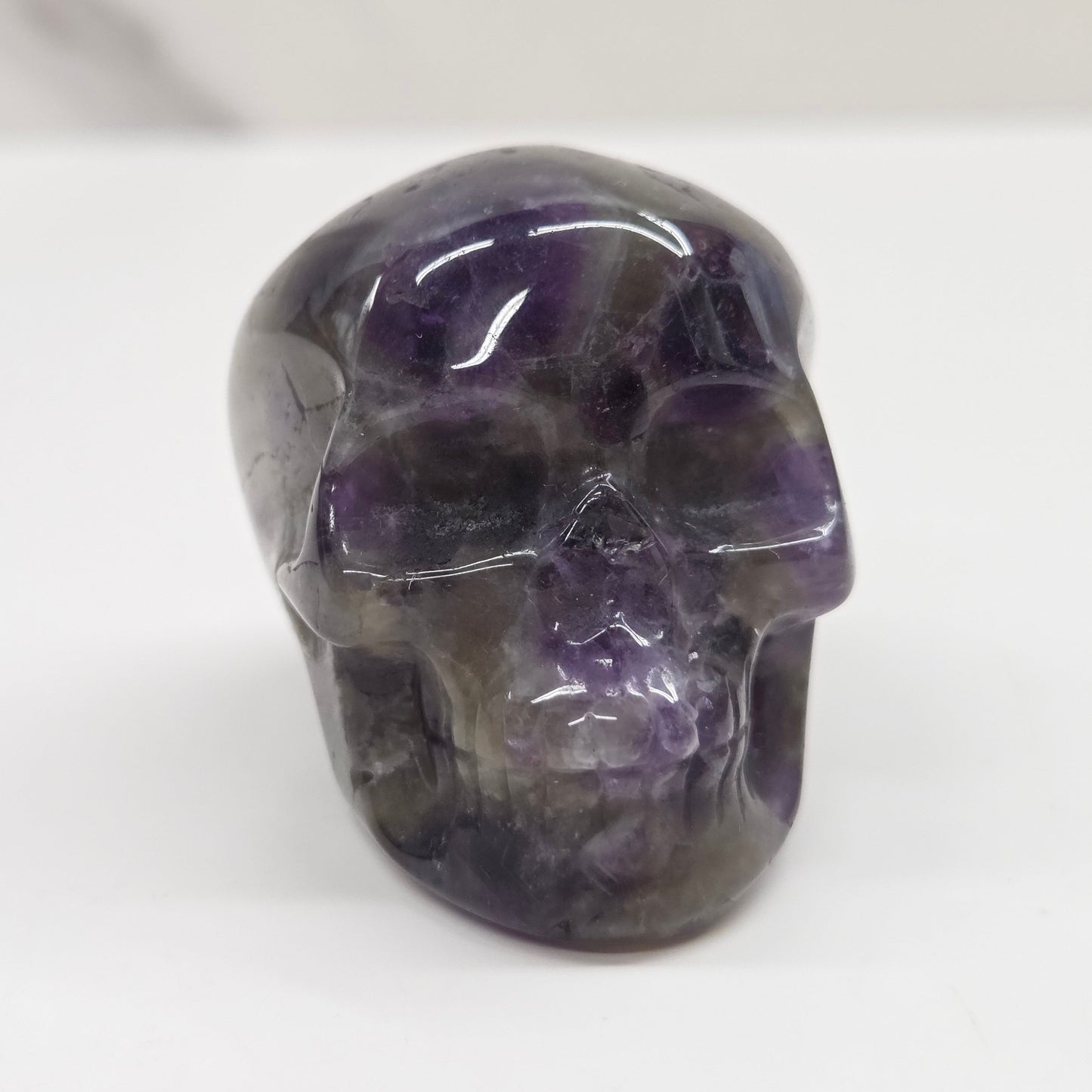 amethyst skull on a white background