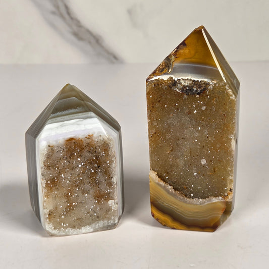 Tow Agate points with crystal druzy on a white background