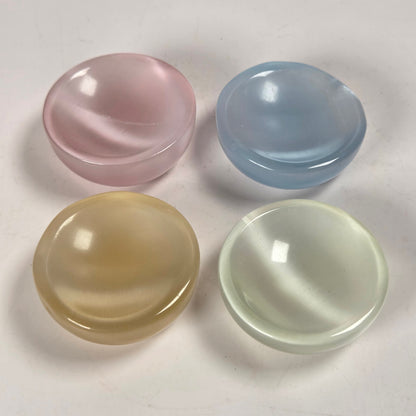 Four colorful bowls against a white background