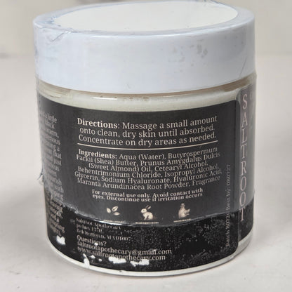 A  jar of facial cleansing foam with a white lid, showing the back of the label with product details, set against a neutral light gray background.