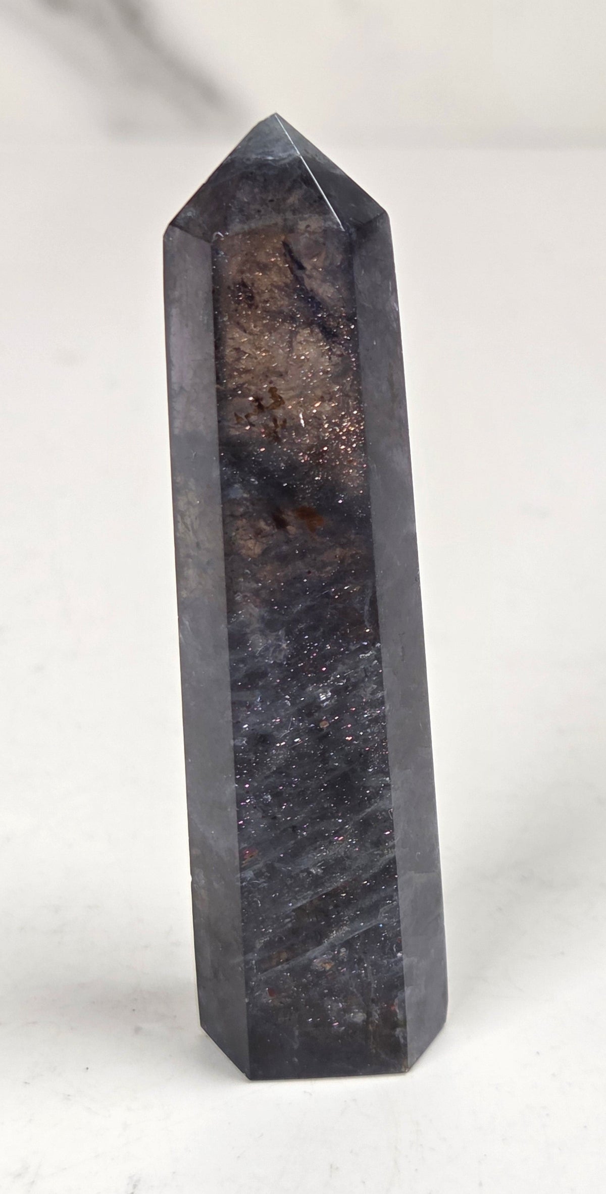 A gray crystal against a white background