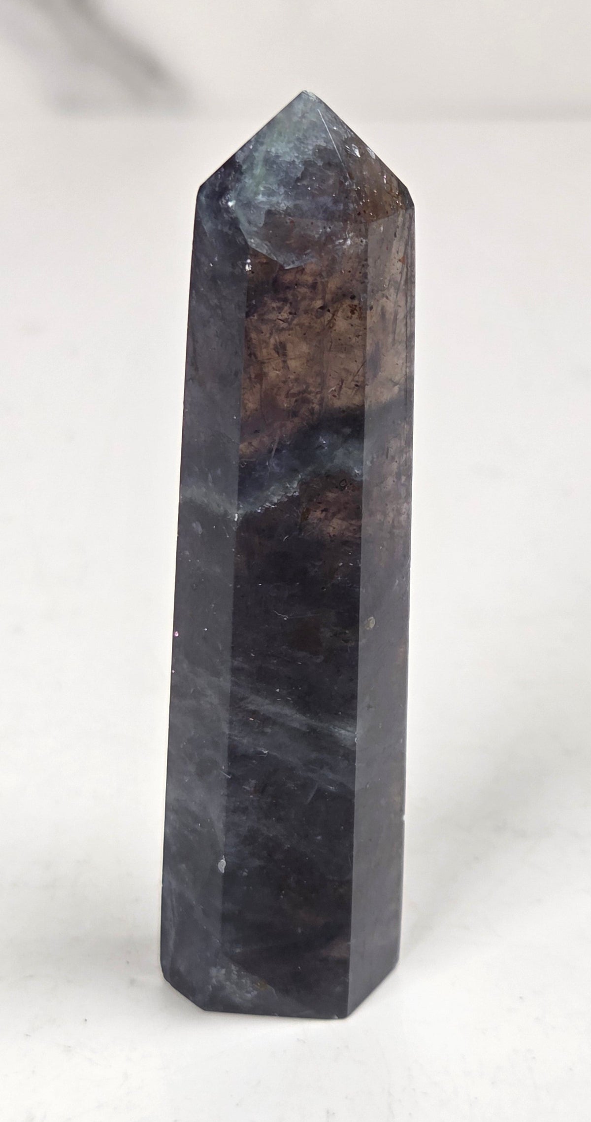 A gray crystal against a white background