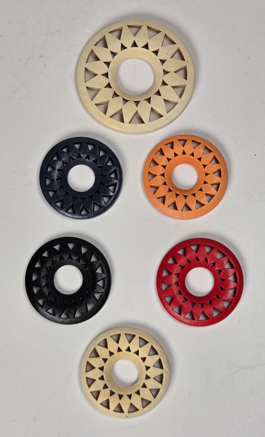 starburst style wood circles in different colors on a white background