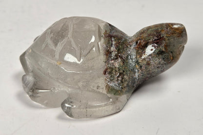 Turtle shaped garden quartz crystal carving on a white background