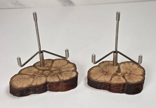 Wood slabs with metal brackets against a white background