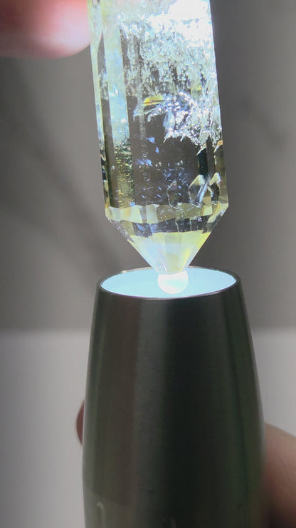 video of crystal point with blue inclusions