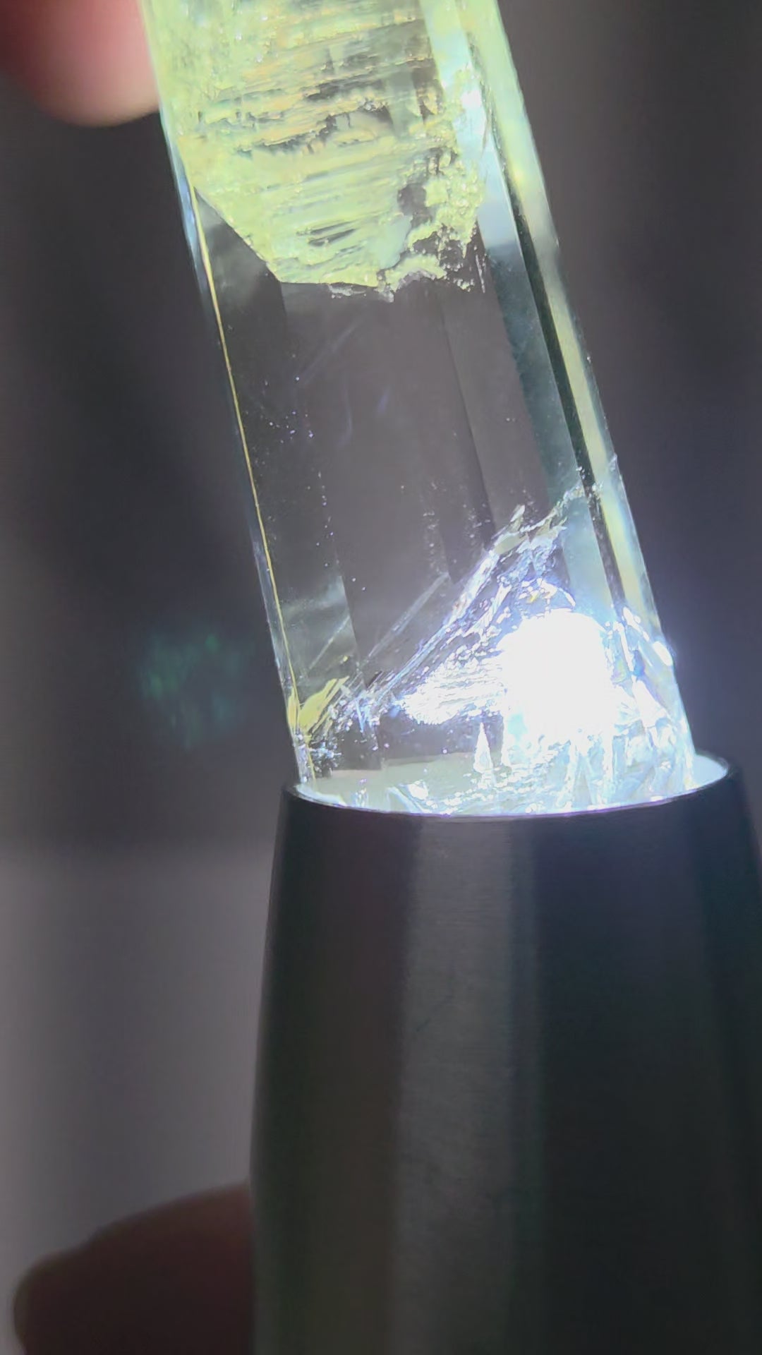 video of crystal point with blue inclusions