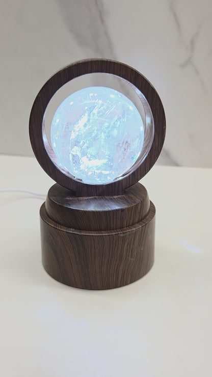 Lighted & rotated sphere stand